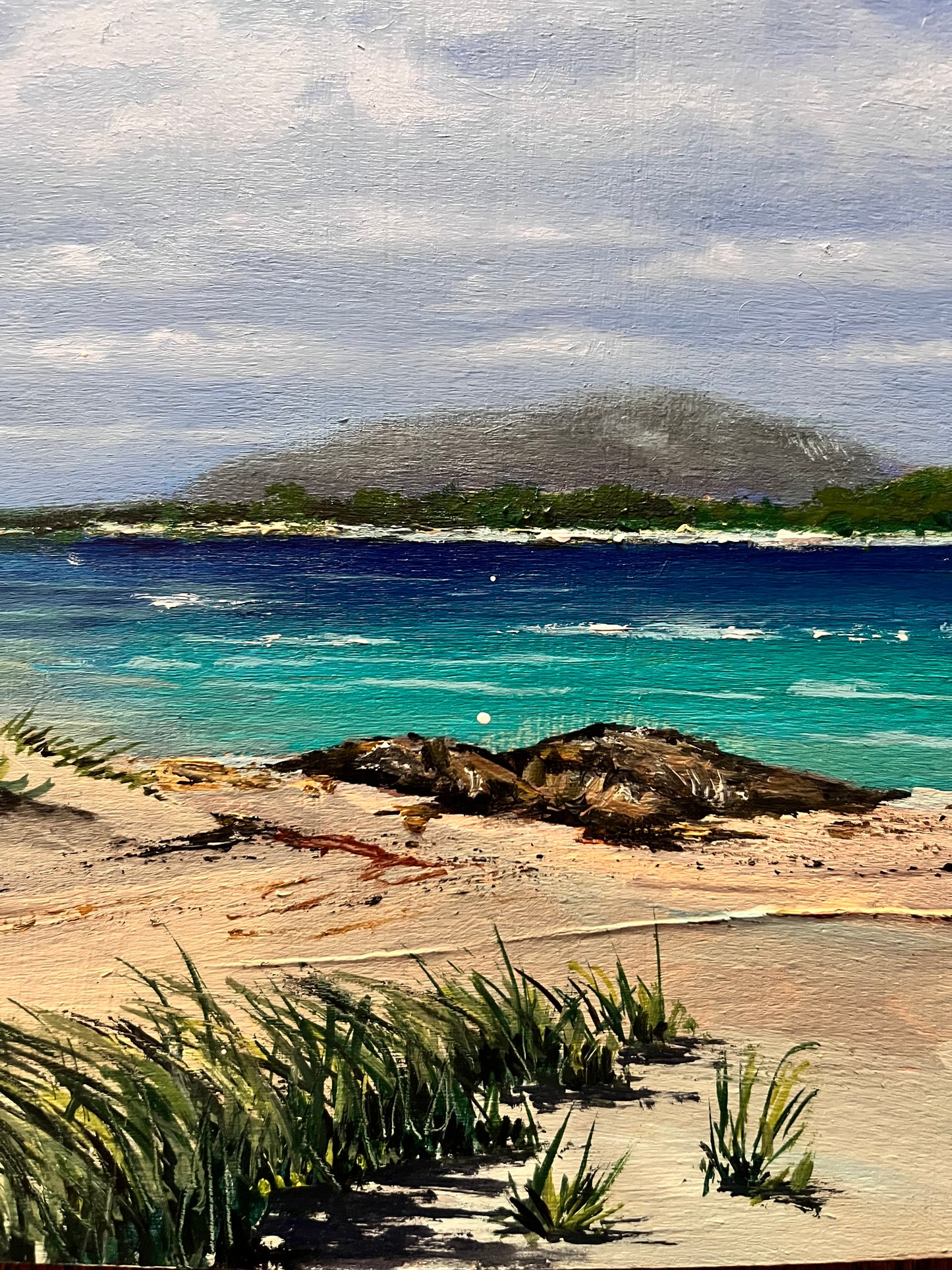 Beach scene in oil on a birch panel